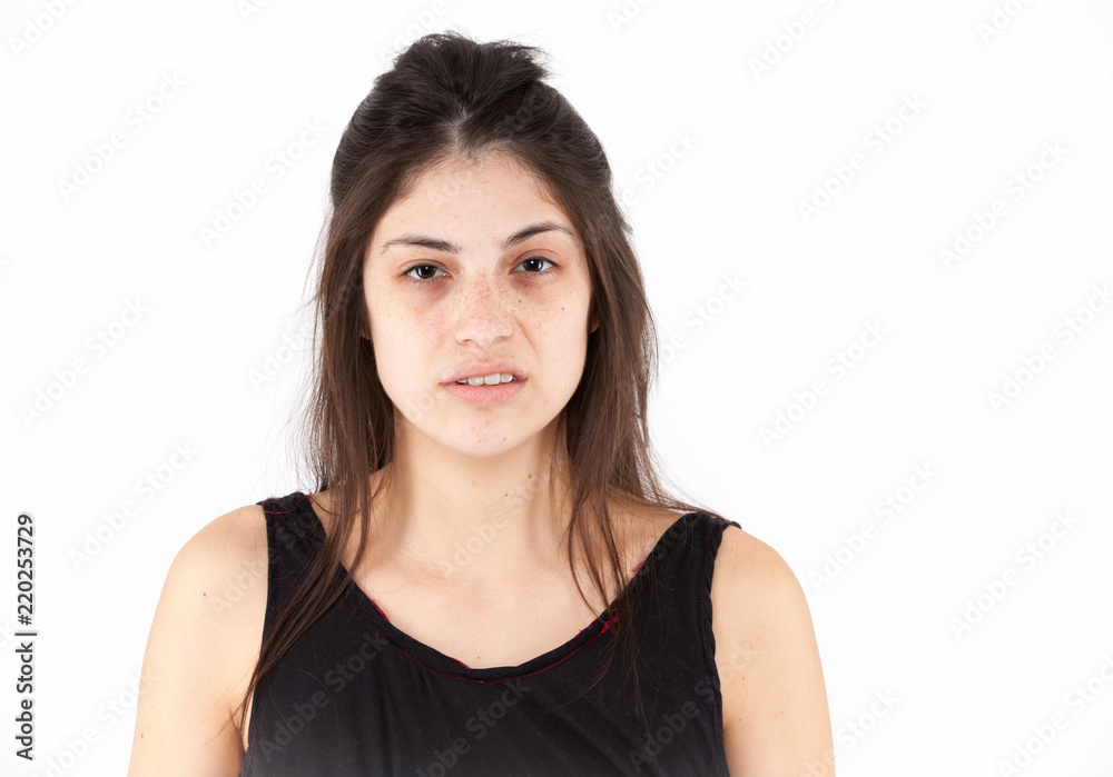 Contempt emotional girl on a light background Contempt emotional girl on a light background