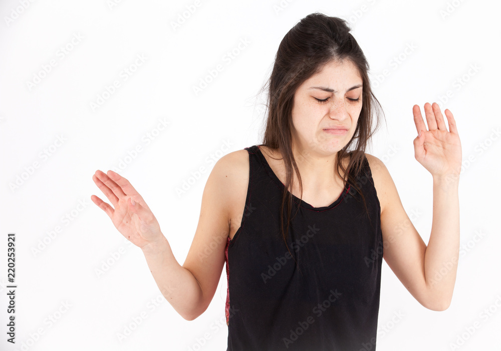 Contempt emotional girl on a light background Contempt emotional girl on a light background