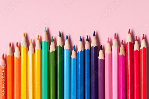 Color pencils isolated on pink background.
