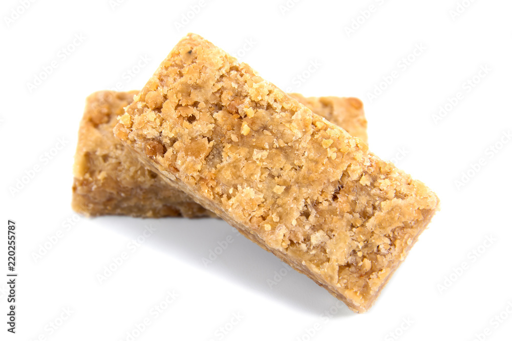 It is two stack of caramel ground peanuts bar isolated on white background.Caramel peanut powder candy bar isolated It is two stack of caramel ground peanuts bar isolated on white background.Caramel peanut powder candy bar isolated