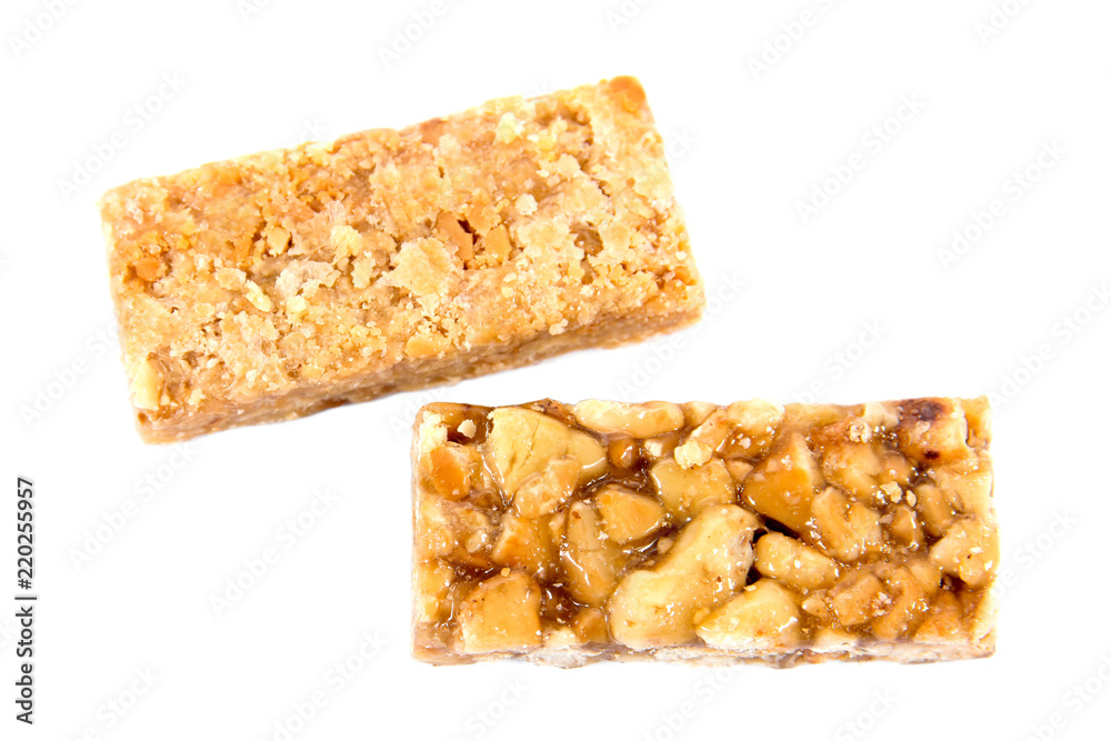 It is two closeup of caramel peanuts bar isolated on white background.Honey brittle peanuts isolated It is two closeup of caramel peanuts bar isolated on white background.Honey brittle peanuts isolated