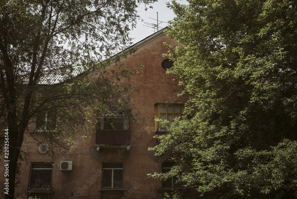Old residential house. Kazakhstan (Ust-Kamenogorsk). Apartment building. Old architecture. Architectural heritage of the past Old residential house. Kazakhstan (Ust-Kamenogorsk). Apartment building. Old architecture. Architectural heritage of the past