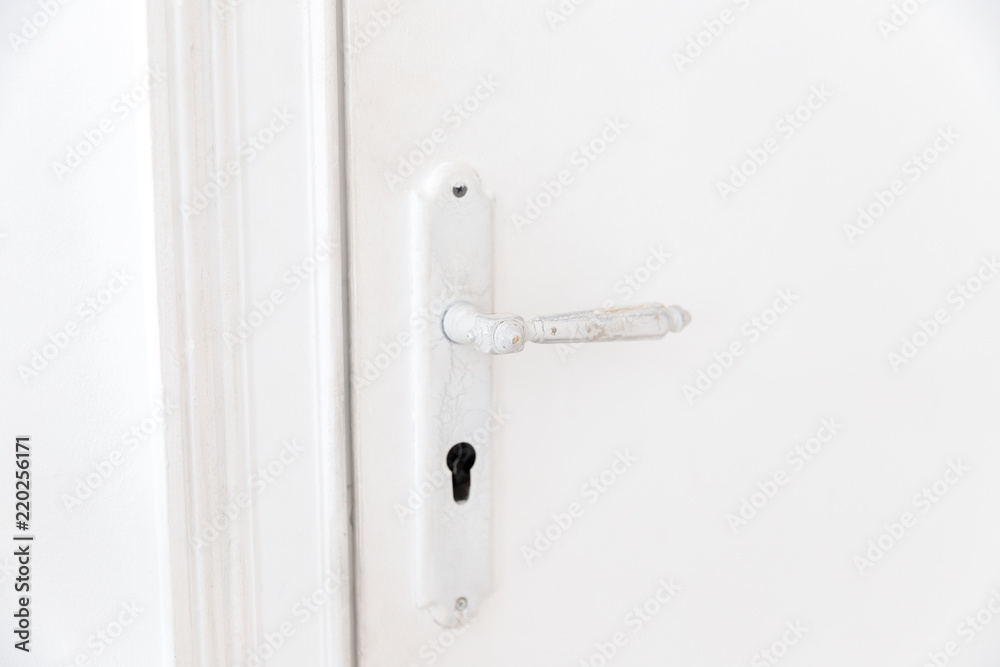 White classic door with handle, keyhole old style