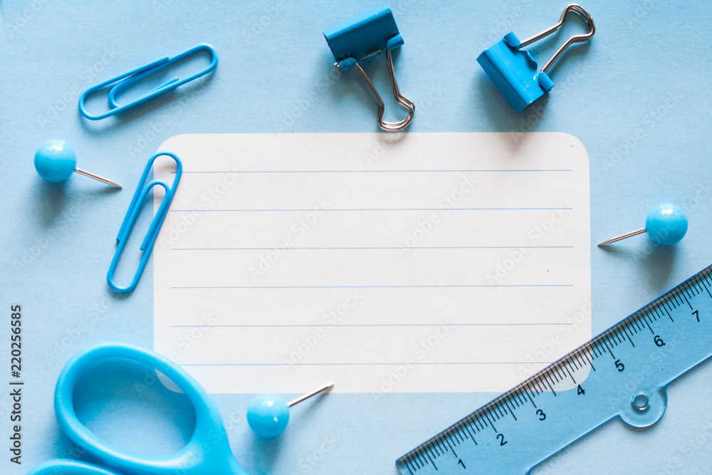 School office supplies on blue background School office supplies on blue background