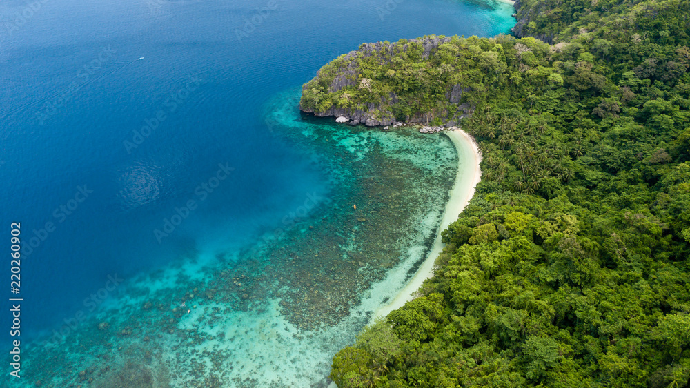 Aerial drone view of a beautiful, sandy tropical beach in Palawan, Philippines