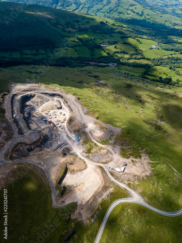 Aerial drone view of an old quarry scarring the countryside in rural Wales, UK photo