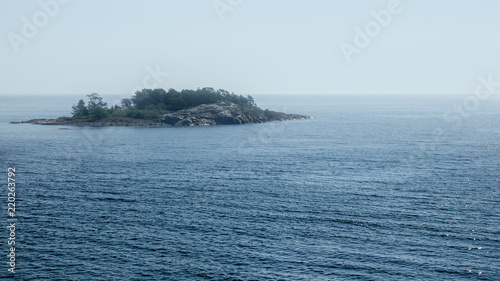 Lonely rocky island in endl...