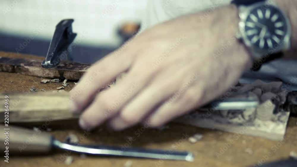 Man is making wooden souvenirs for tourists in Ohrid, Macedonia Man is making wooden souvenirs for tourists in Ohrid, Macedonia