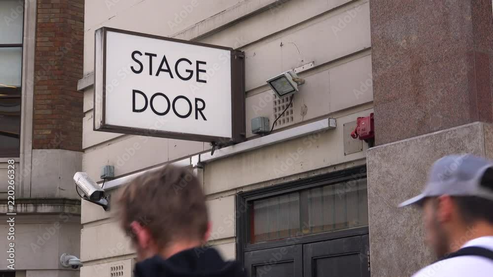 A generic stage door leads actors and performers to the backstage of a local theater in London, England.