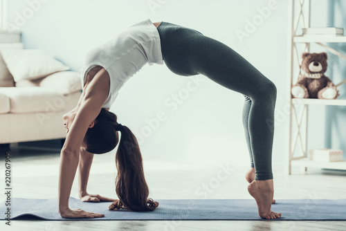 Young Sporty Woman doing Gimnastic Exercises