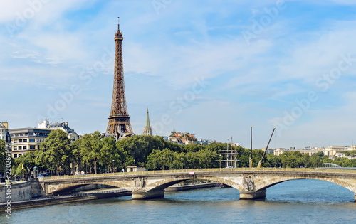 Eiffel Tower iconic landmark of Paris and pont des invalides bridge over the river Seine © zefart