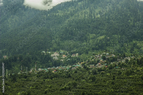 heavy cloud on the green mountain and the village