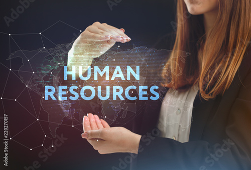 The concept of business, technology, the Internet and the network. A young entrepreneur working on a virtual screen of the future and sees the inscription: Human resources