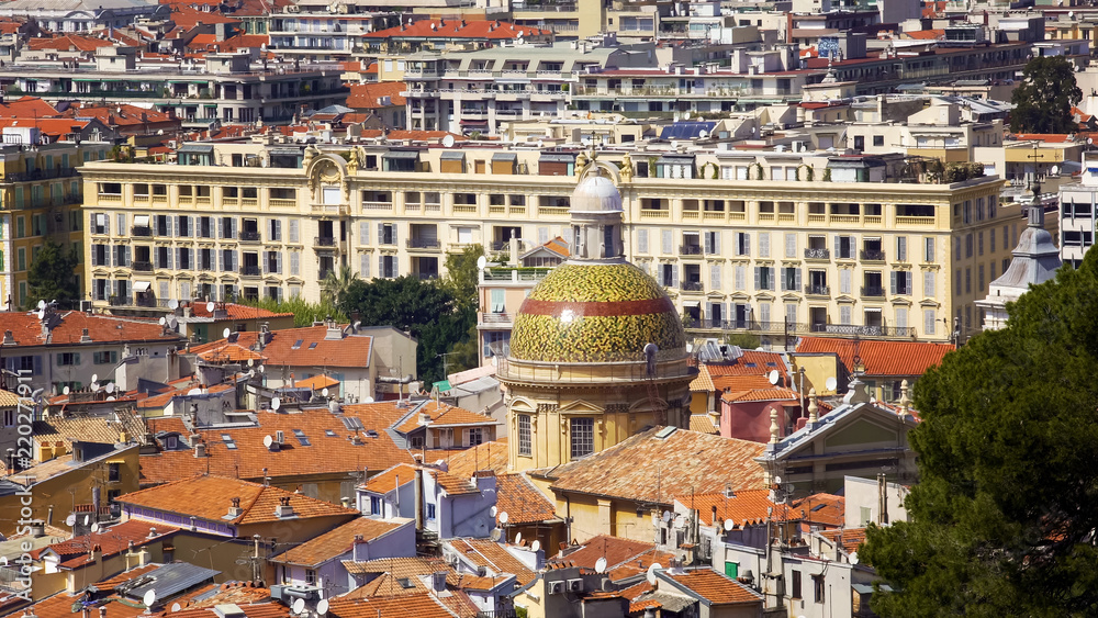 Dome Of Nice Cathedral among rooftops, tourism on French Riviera, architecture