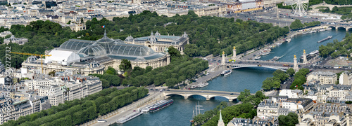 Aerial panoramic view of Alexandere III and Invalides bridges on Seine river and Grand Palais and Petit Palais  in Paris, France