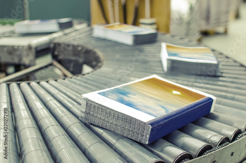 Book, magazine,  production line into press plant house. Automatic assembly line.