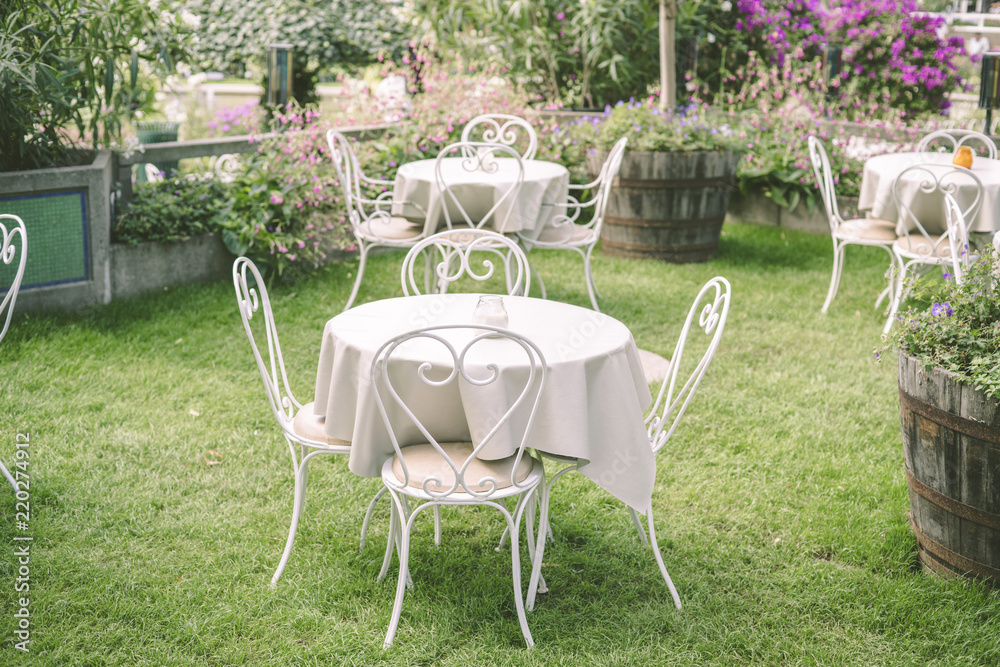 Romantic garden setting with vintage furniture