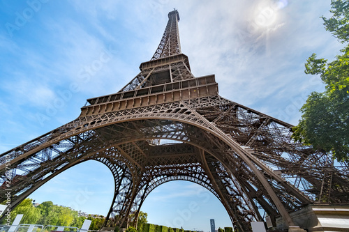 Post card of iconic landmark Eiffel tower in Paris against spring blue sky