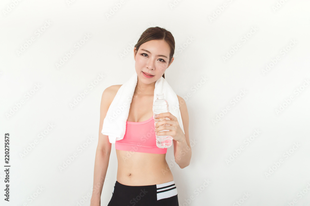 Exercise concept. Athletes are tired of exercising. Beautiful girl drinking water after exercise. Exercise concept. Athletes are tired of exercising. Beautiful girl drinking water after exercise.