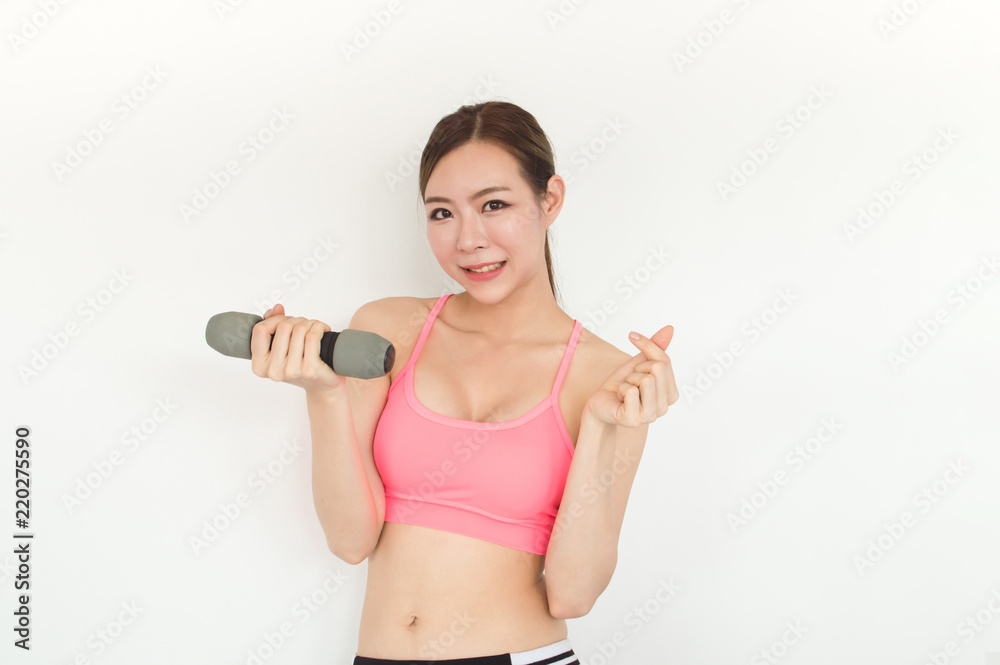 Sports concept. Beautiful girl is exercising in the home with warm up. Beautiful girl is happy to exercise.Beautiful women playing sports for health. Sports concept. Beautiful girl is exercising in the home with warm up. Beautiful girl is happy to exercise.Beautiful women playing sports for health.