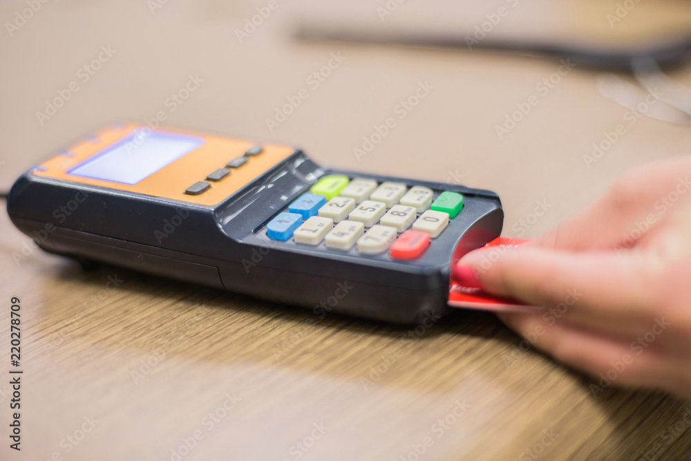 Credit card terminal. Credit Card Processor. Payment machine and Credit card in supermarket.