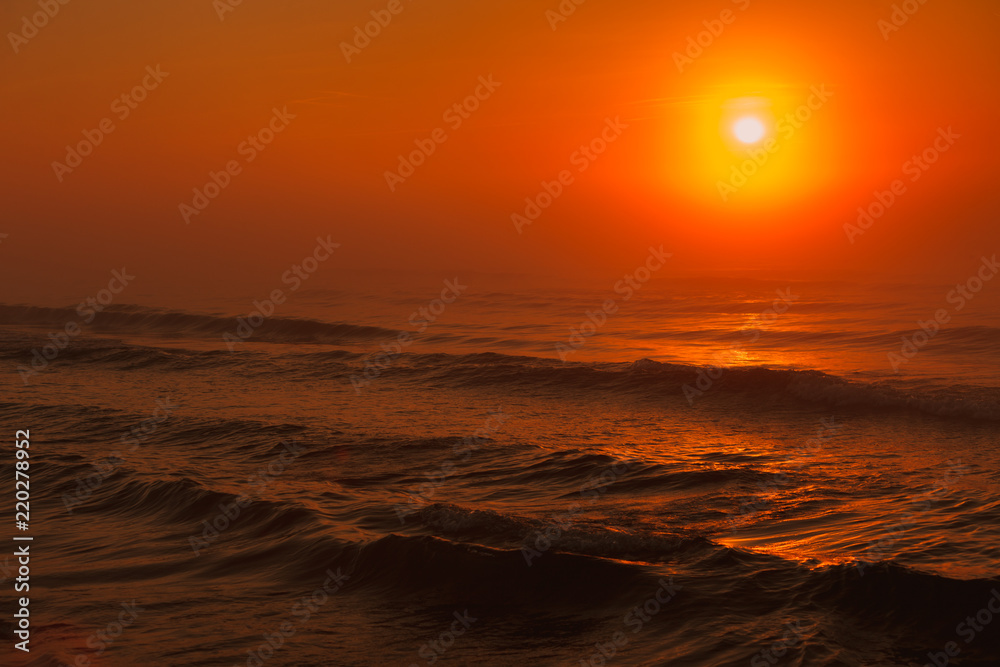 Beatiful red sunset over sea surface Beatiful red sunset over sea surface