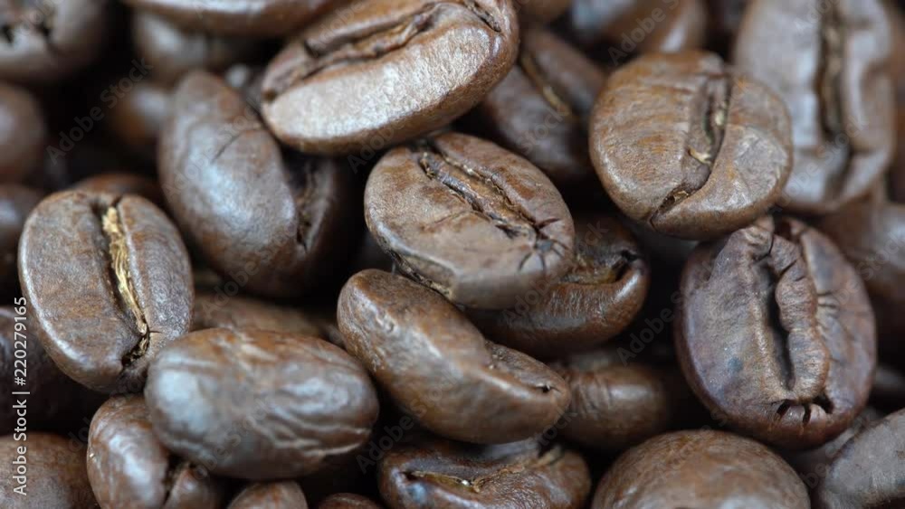 Fried coffee beans background, close up, rotation loopable 4k top view. Food background. Gastronomy concept, organic food. Macro coffee beans Fried coffee beans background, close up, rotation loopable 4k top view. Food background. Gastronomy concept, organic food. Macro coffee beans