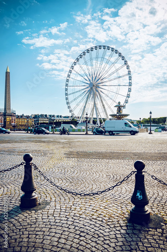 France,Ile de France,Paris,Concorde town square traffic with central Ferris Wheel and Obelisk, vertical photo