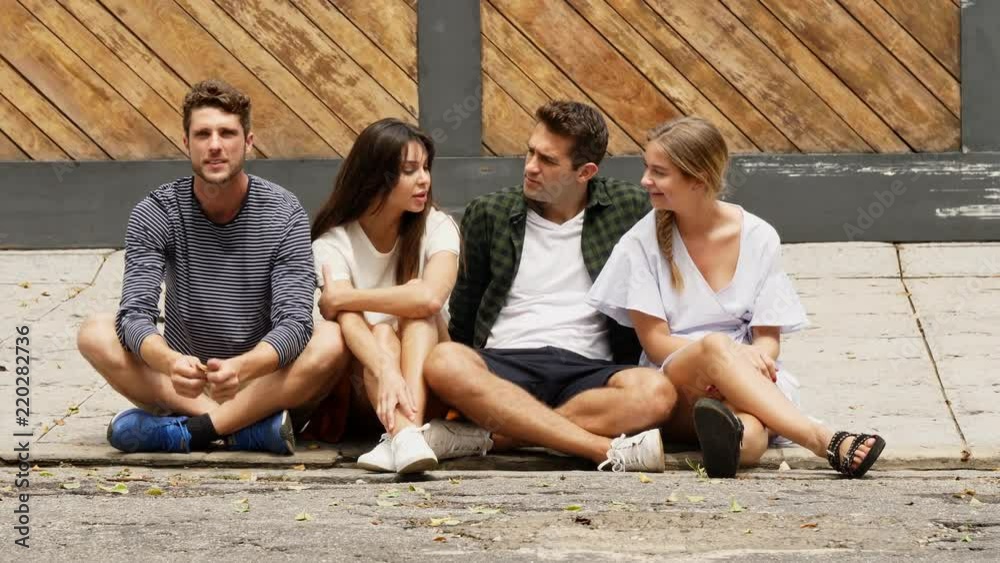 Friends chatting in street
