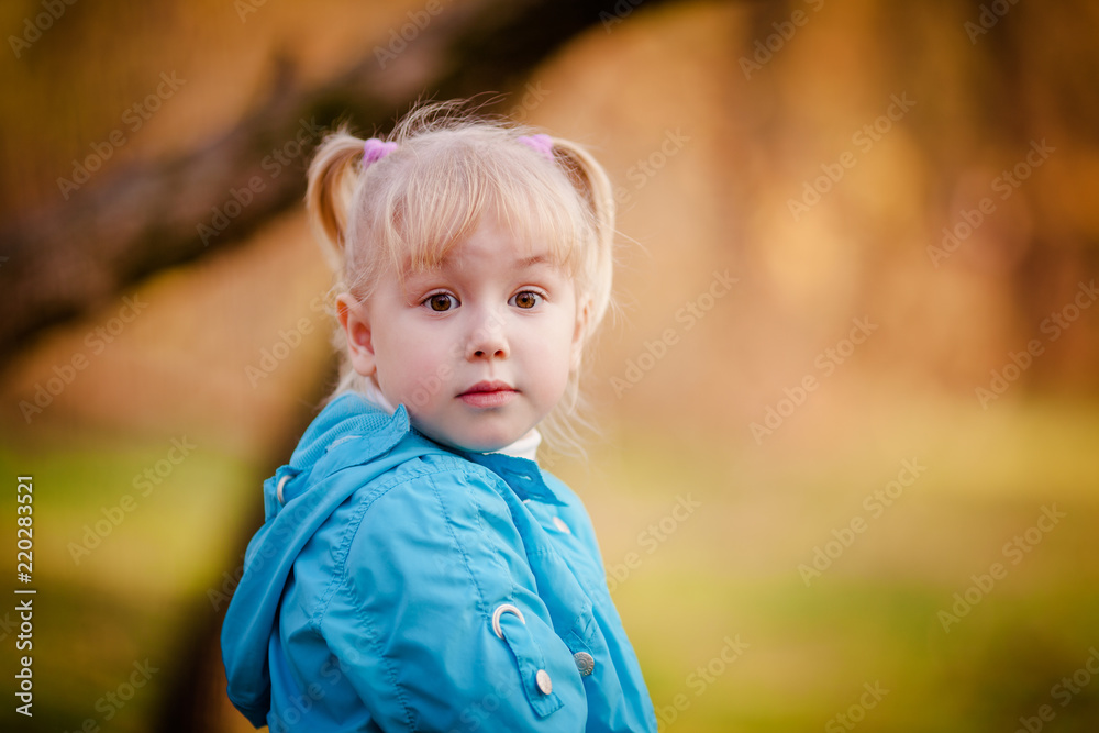 Portrait of little girl in autumn park Portrait of little girl in autumn park