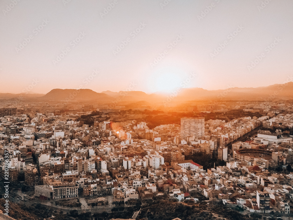 Sunset over Alicante city with mountains in the background