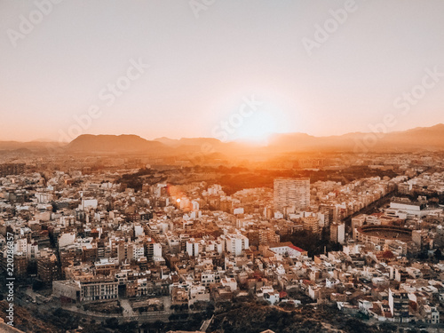 Sunset over Alicante city with mountains in the background