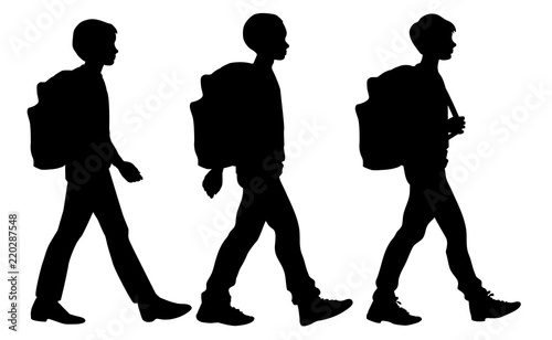 Isolated silhouettes of going boys with school  backpacks