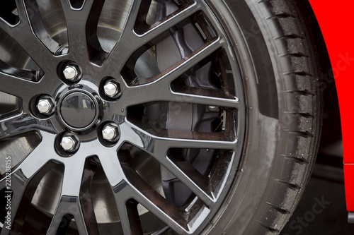 Powerful brakes on a modern car. Black alloy wheels with big tyres and black styled brakes.