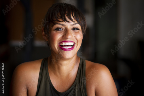 Happy Latina Woman Smiling, Fitness Model at the Gym photo