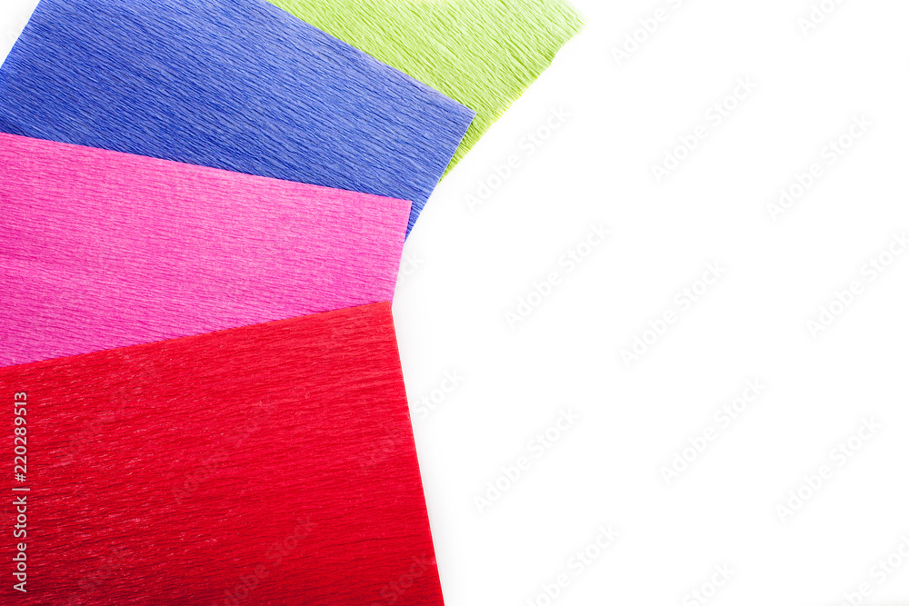 Crepe paper. Red, pink, green and blue craft sheets. Stock Photo