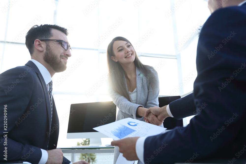 business woman and investor with a handshake. business woman and investor with a handshake.