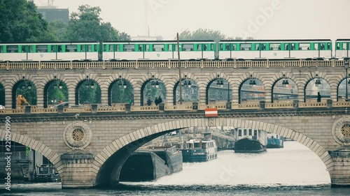 Line 6 subway on a Ponde de Bercy bridge over Seine in Paris, France photo