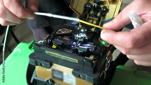 Working on fiber optic cable splice machine, technology for high internet speed
