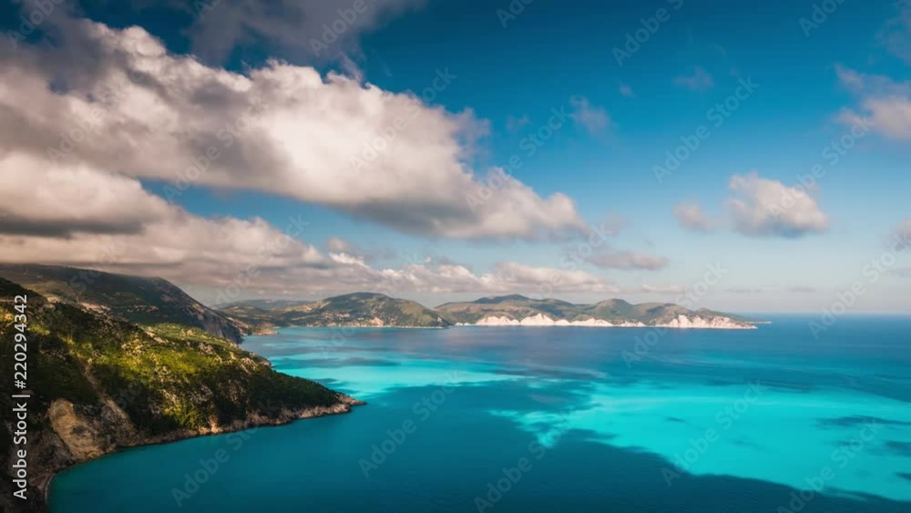 Clouds flowing over picturesque rocky coastline on Kefalonia island. Amazing footage with cloudscape and shadows on sea surface. Greece 4k time lapse. Clouds flowing over picturesque rocky coastline on Kefalonia island. Amazing footage with cloudscape and shadows on sea surface. Greece 4k time lapse.