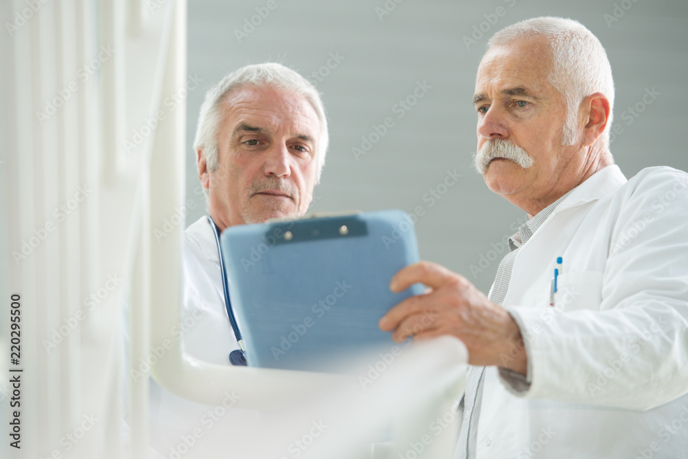 senior doctors concentrated on patients case senior doctors concentrated on patients case