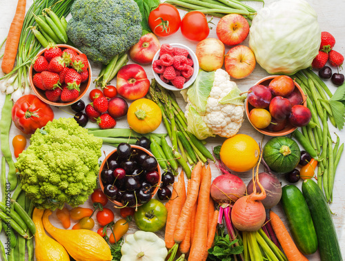 Fototapeta Naklejka Na Ścianę i Meble -  Summer fruits vegetables berries background, apples cherries peaches strawberries cabbage broccoli cauliflower squash tomatoes carrots spring onions beetroot, copy space, top view, selective focus