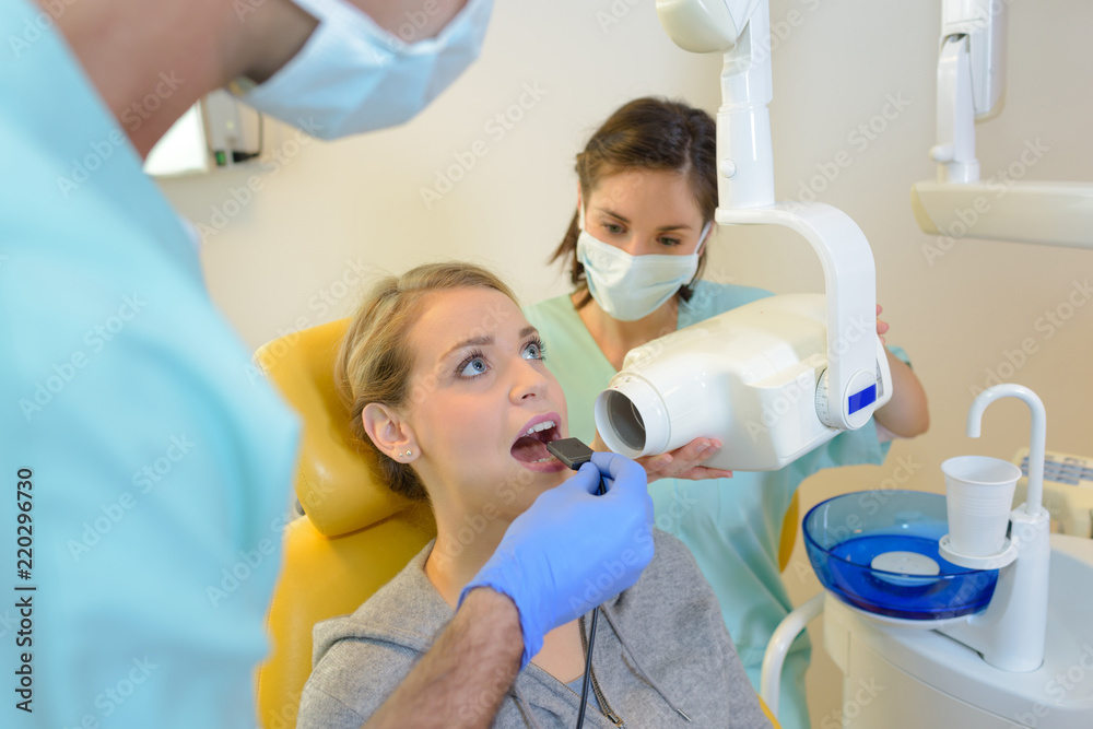 Woman having dental xray Woman having dental xray