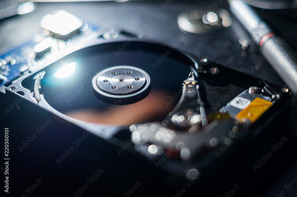 Hard disk shot in netherlands tilt. Concept: Information, repairing Hard disk shot in netherlands tilt. Concept: Information, repairing