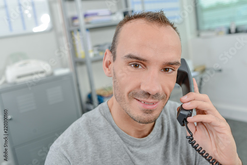 Office worker speaking to a customer on the phone
