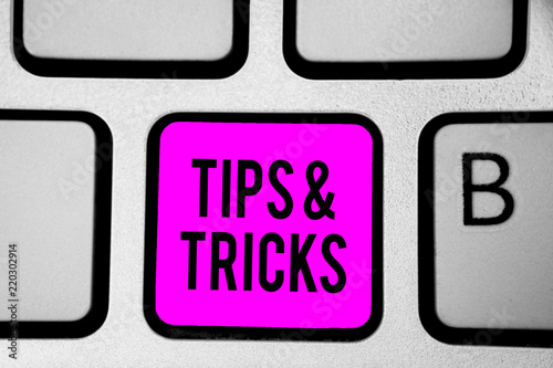 Conceptual hand writing showing Tips and Tricks. Business photo text Steps Lifehacks Handy advice Recommendations Skills Keyboard purple key Intention create computer reflection document photo