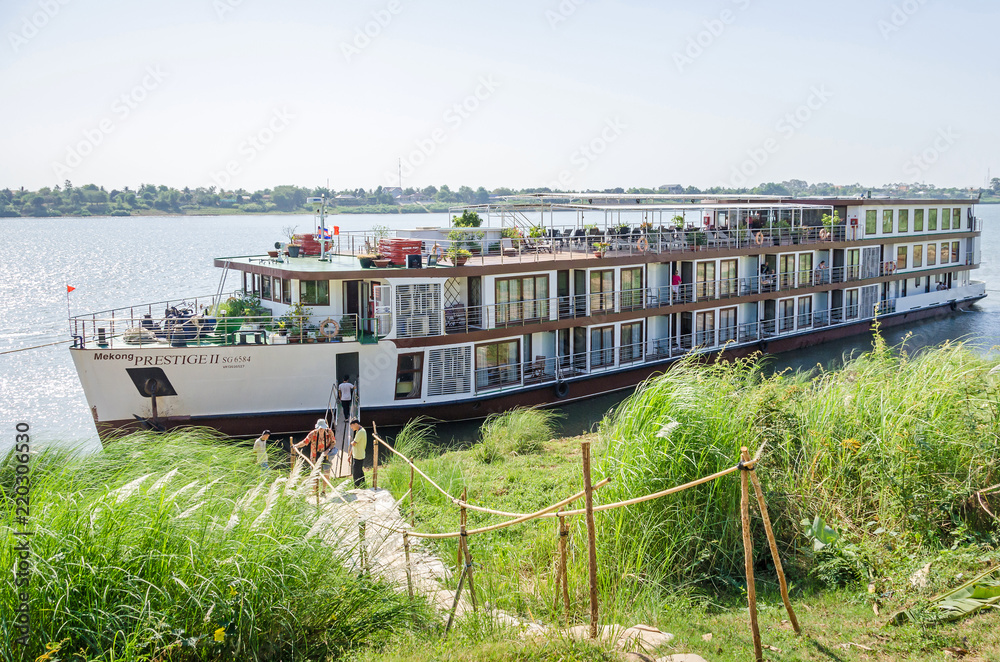 Cruise ship Mekong Prestige II anchored at the bank of Chong Koh island on the river Mekong Cruise ship Mekong Prestige II anchored at the bank of Chong Koh island on the river Mekong