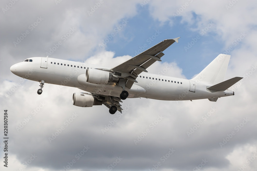 No name white passenger plane approaching to the airport No name white passenger plane approaching to the airport