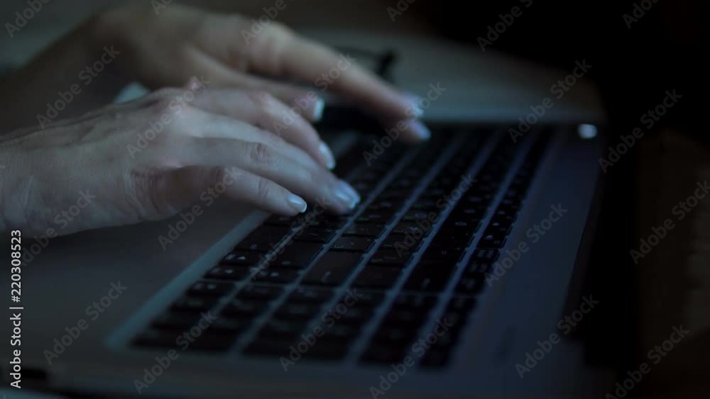 Close-up of woman's hands with beautiful manicure typing and working with the laptop. Close-up of woman's hands with beautiful manicure typing and working with the laptop.
