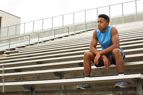 Photography Young African Amerian teenage athlete thinking about his future.